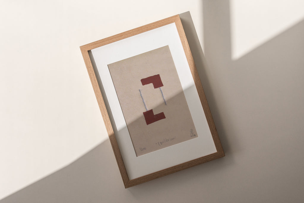 The Adorned framed and hand stitched block printed artwork called Equilibrium Terracotta with shadow across image