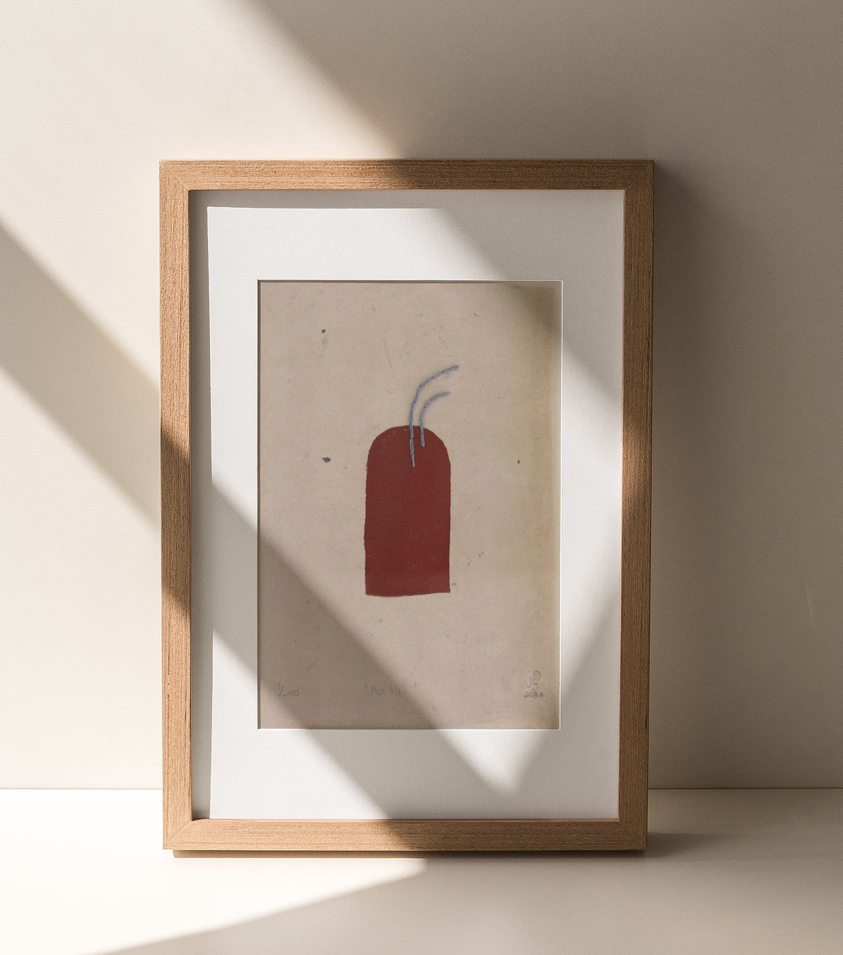 The Adorned framed and hand stitched block printed artwork called The Portal with shadows across frame
