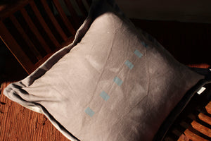 natural botanical dyed cushion with block printed geometric pattern by The Adorned. Dyed with black wattle and sage called Foundation.